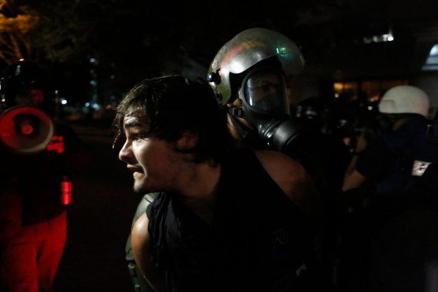 National police transport an anti-government protester detainee during a protest against Venezuelan President Maduro's government, in Caracas