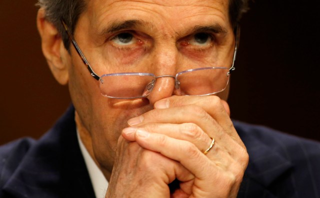 U.S. Secretary of State John Kerry waits to testify before the Senate Foreign Relations Committee while on Capitol Hill in Washington