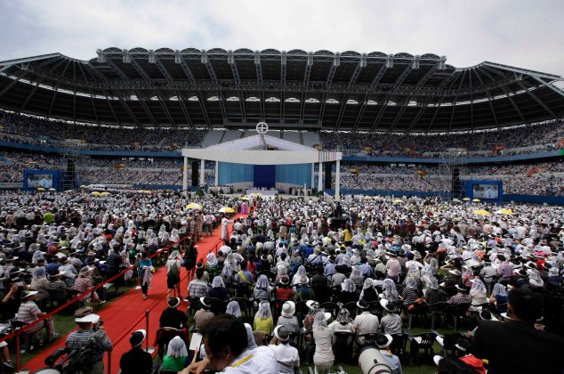 Faithfuls gather during the Holy Mass at Daejeon World Cup stadium in Daejeon