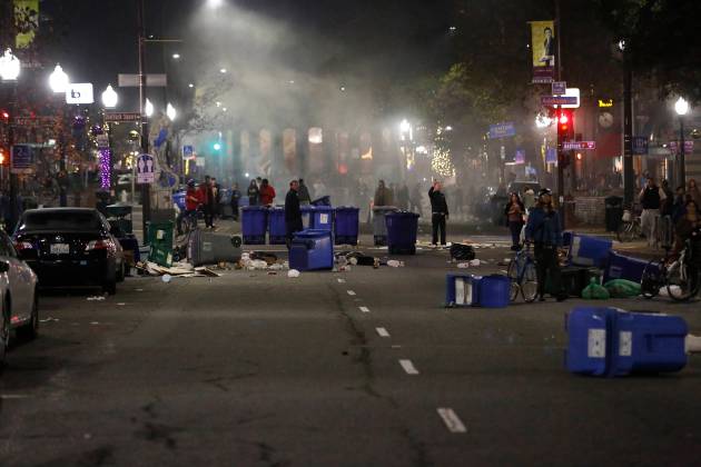 Trash bins are seen littered on Shattuck Avenue after a march against the New York City grand jury decision to not indict in the death of Garner turned violent in Berkeley