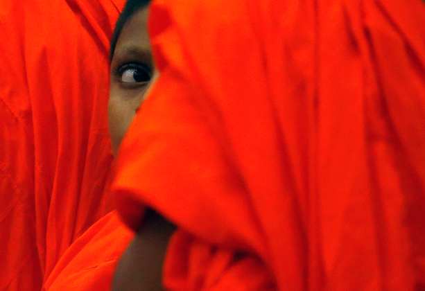 A Buddist monk looks on during the Interreligious Encounter at the Bmich in Colombo