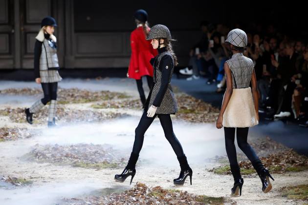 Models present creations by Italian designer Giambattista Valli as part of his Autumn/Winter 2015/2016 women's ready-to-wear collection for fashion house Moncler Gamme Rouge in Paris