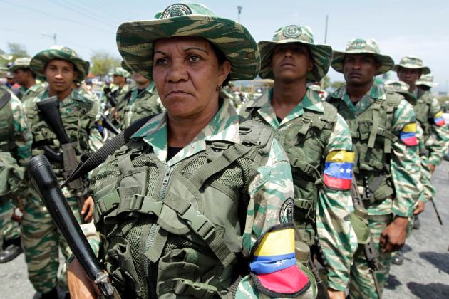 Militia members take part in a defensive military exercise in conjunction with the general public in La Guaira