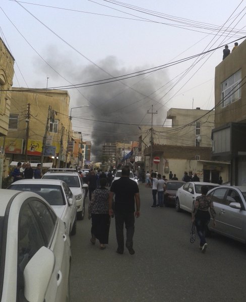 Smoke rises from the site of a bomb attack in Erbil, the capital of Iraq's Kurdistan region