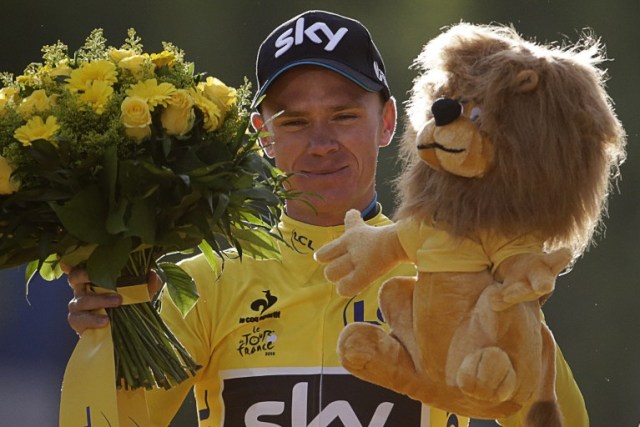 Tour de France 2015's winner Great Britain's Christopher Froome celebrates his victory on the podium on the Champs-Elysees avenue, at the end of the 109,5 km twenty-first and last stage of the 102nd edition of the Tour de France cycling race on July 26, 2015, between Sevres and Paris.  AFP PHOTO / KENZO TRIBOUILLARD