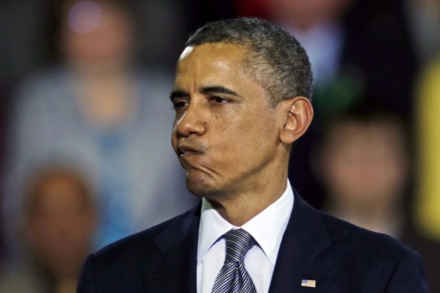 President Obama pauses during his address during a visit to the University of Hartford, in Hartford, Conn., Monday, April 8, 2013. Obama visited the school to highlight gun control legislation and to meet with the families of victims from the Sandy Hook elementary school shootings.(AP Photo/Charles Krupa)