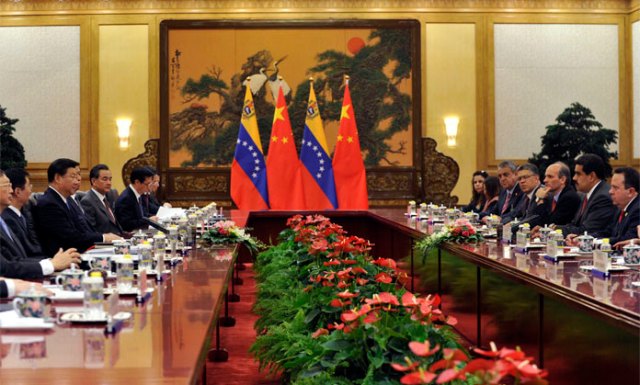 Chinese President Xi Jinping, third left, and Venezuela's President Nicolas Maduro second right, hold a talk at the Great Hall of the People in Beijing, China, Tuesday, Sept. 1, 2015. (Parker Song/Pool Photo via AP)