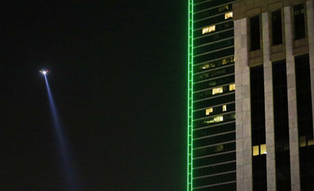 DALLAS, TX - JULY 8: A Dallas police helicopter flies over the scene where eleven Dallas police officers were shot and five have now died on July 7, 2016 in Dallas, Texas. According to reports, shots were fired during a protest being held in downtown Dallas in response to recent fatal shootings of two black men by police - Alton Sterling on July 5, 2016 in Baton Rouge, Louisiana and Philando Castile on July 6, 2016, in Falcon Heights, Minnesota.   Ron Jenkins/Getty Images/AFP