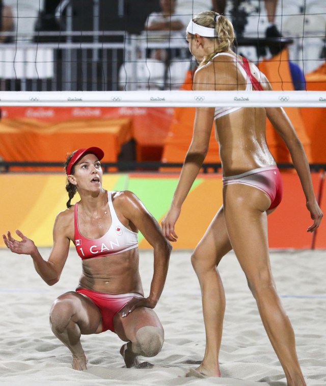 2016 Rio Olympics - Beach Volleyball - Women's Preliminary - Beach Volleyball Arena - Rio de Janeiro, Brazil - 09/08/2016. Kristina Valjas (CAN) of Canada and Jamie Lynn Broder (CAN) of Canada react. REUTERS/Ruben Sprich   FOR EDITORIAL USE ONLY. NOT FOR SALE FOR MARKETING OR ADVERTISING CAMPAIGNS.