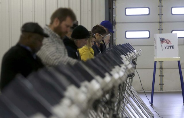 Voters cast their ballots during the U.S. presidential election in Medina, Ohio, U.S. November 8, 2016.  REUTERS/Aaron Josefczyk