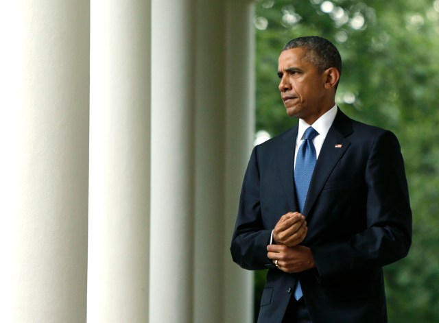 U.S. President Barack Obama walks out of the Oval Office to comment on the Supreme Court ruling on the constitutionality of same-sex marriage, at the White House in Washington June 26, 2015. REUTERS/Gary Cameron/File Photo