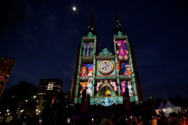 A Christmas-themed projection illuminates the facade of Sydney's St Mary's Cathedral on the opening night of the Catholic church's celebration of the Christmas season in Australia, December 8, 2016. REUTERS/Jason Reed FOR EDITORIAL USE ONLY. NO RESALES. NO ARCHIVES.