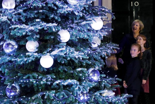 Britain's Prime Minister Theresa May reacts as the Downing Street Christmas tree lights are turned on in London, Britain December 8, 2016. REUTERS/Stefan Wermuth TPX IMAGES OF THE DAY