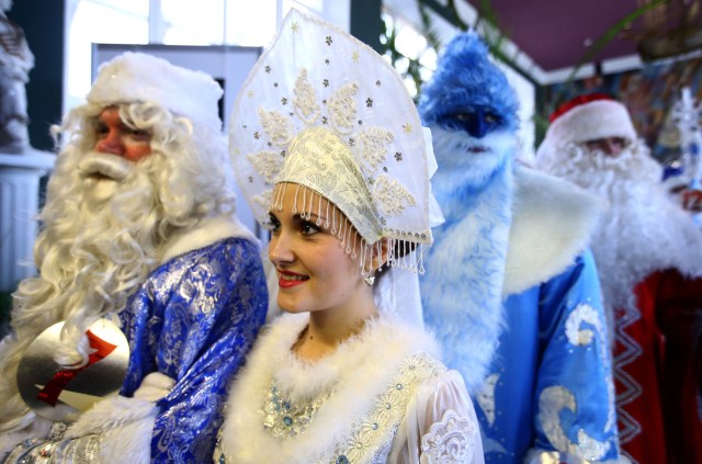 People dressed as Father Frost, the equivalent of Santa Claus, and Snow Maiden take part in the contest "Yolka-fest-2016" (Fir-festival-2016) in Minsk, Belarus December 9, 2016. REUTERS/Vasily Fedosenko