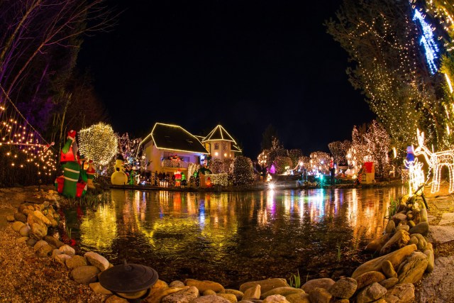 CBR112. Vienna (Austria), 03/12/2016.- A picture taken with a fisheye lens shows illuminated Christmas decoration at the 'Christmas House' estate of the Gollnhuber family in Bad Tatzmannsdorf, Austria, 03 December, 2016. Since six years, the Gollnhuber family installs over half a million Christmas lights and up to 70 inflatable Christmas figures, attracting thousands of visitors. EFE/EPA/CHRISTIAN BRUNA TAKE WITH A FISH EYE LENS