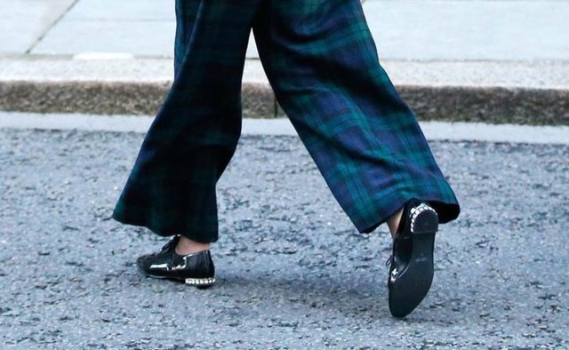 Britain's Prime Minister Theresa May wears shoes encrusted with a line of shiny stones as she returns to 10 Downing Street, London, January 17, 2017.  REUTERS/Peter Nicholls