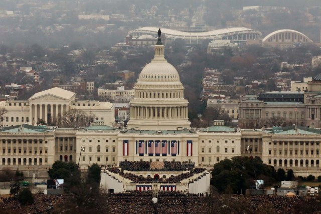 Attendees partake in the inauguration ceremonies to swear in Donald Trump as the 45th president of the United States at the U.S. Capitol in Washington, U.S., January 20, 2017. REUTERS/Lucas Jackson