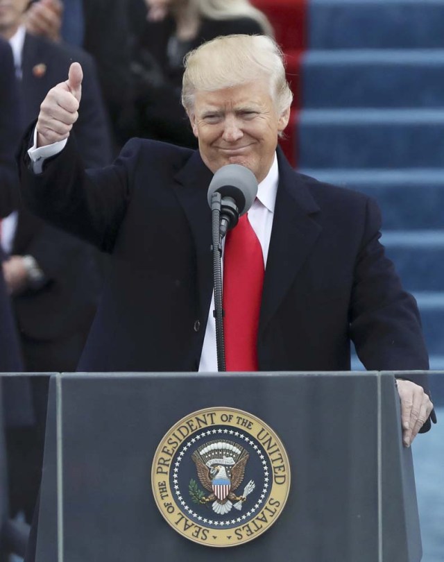 President Donald Trump waves after taking the oath at inauguration ceremonies swearing in Trump as the 45th president of the United States on the West front of the U.S. Capitol in Washington, U.S., January 20, 2017. REUTERS/Carlos Barria