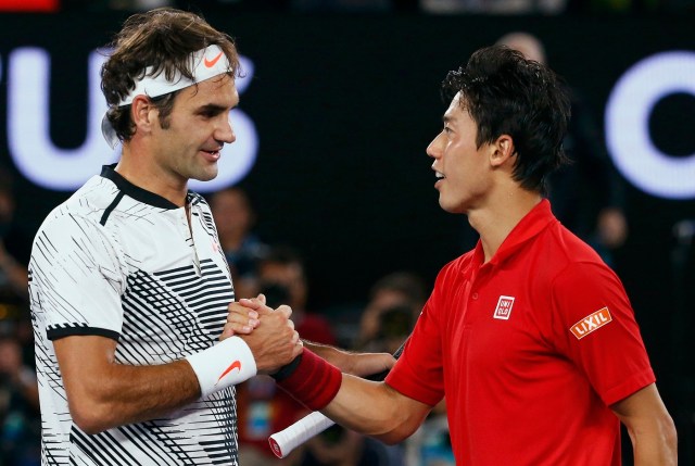 Tennis - Australian Open - Melbourne Park, Melbourne, Australia - 22/1/17 Switzerland's Roger Federer shakes hands after winning his Men's singles fourth round match against Japan's Kei Nishikori. REUTERS/Edgar Su