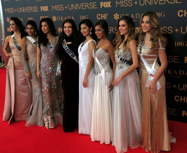 Miss Universe candidates pose for a picture during a red carpet inside a SMX convention in metro Manila, Philippines January 29, 2017. In Photo from L-R: Miss Nicaragua Marina Jacoby, Miss Malaysia Kiran Jassal, Miss Korea Jenny Kim, Miss Kazakhstan Darina Kulsitova, Miss Japan Sari Nakazawa, Miss Guam Muneka Taisipic, Miss Czech Republic Andrea Bezdekova and Miss Boliva Antonella Moscatelli. REUTERS/Romeo Ranoco