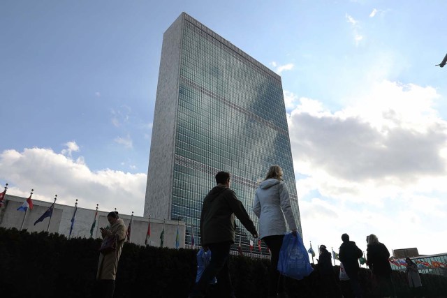 NEW YORK, NY - JANUARY 26: Pedestrians walk by the United Nations in midtown Manhattan on January 26, 2017 in New York City. President Donald Trump is preparing executive orders that would reduce US funding of the United Nations and other international organizations. The first order would cut funding for any U.N. agency or other international group that meets any specific criteria. Organizations and groups to receive cuts may include peacekeeping missions, the International Criminal Court and the United Nations Population Fund. Spencer Platt/Getty Images/AFP