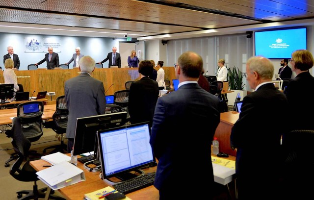 Officials involved with the Royal Commission into Institutional Responses to Child Sexual Abuse stand as the public hearing into the Catholic Church authorities, begins another session in Sydney, Australia, February 6, 2017. Jeremy Piper/Handout via REUTERS    ATTENTION EDITORS - THIS IMAGE WAS PROVIDED BY A THIRD PARTY. EDITORIAL USE ONLY. NO RESALES. NO ARCHIVE.