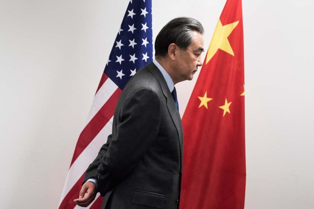 China's Foreign Minister Wang Yi waits for US Secretary of State Rex Tillerson (not in picture) before a meeting on the sidelines of a gathering of Foreign Ministers of the G20 leading and developing economies at the World Conference Center in Bonn, western Germany, February 17, 2017. REUTERS/Brendan Smialowski/Pool