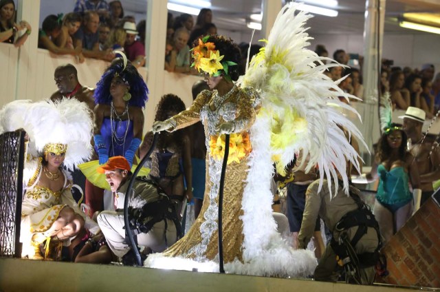 A reveller is assisted after an accident with a float from Unidos da Tijuca samba school during the second night of the carnival parade at the Sambadrome in Rio de Janeiro, Brazil, February 28, 2017. REUTERS/Pilar Olivares