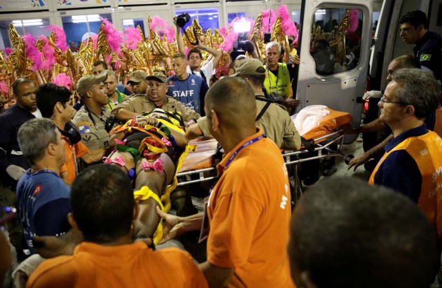 A reveller is helped after an accident with a float from Unidos da Tijuca samba school during the second night of the carnival parade at the Sambadrome in Rio de Janeiro, Brazil, February 28, 2017. REUTERS/Ricardo Moraes