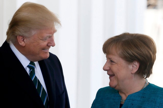 U.S. President Donald Trump greets German Chancellor Angela Merkel at the White House in Washington, U.S., March 17, 2017. REUTERS/Jim Bourg