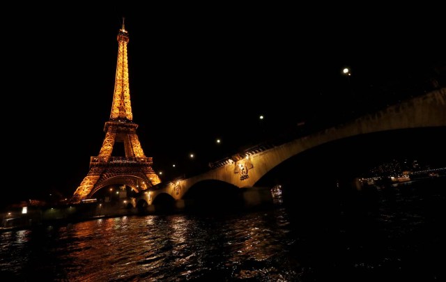 The Eiffel Tower is pictured before Earth Hour in Paris, France, March 25, 2017, at which lights are switched off around the world at 8:30 p.m. on Saturday evening to mark the 10th annual Earth Hour and to draw attention to climate change. REUTERS/Philippe Wojazer