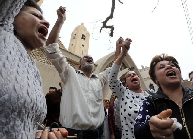 Relatives of victims react in front of a Coptic church that was bombed on Sunday in Tanta, Egypt, April 9, 2017. REUTERS/Mohamed Abd El Ghany