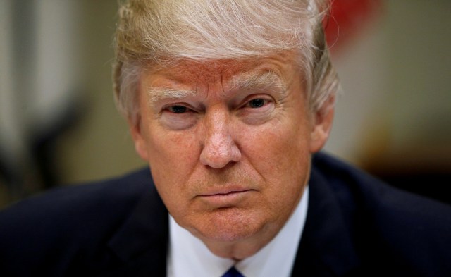 FILE PHOTO: U.S. President Donald Trump looks up while hosting a House and Senate leadership lunch at the White House in Washington, U.S., March 1, 2017. REUTERS/Kevin Lamarque/File Photo