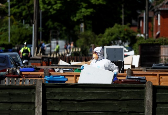 Police investigators work at residential property in south Manchester, Britain May 23, 2017. REUTERS/Stefan Wermuth