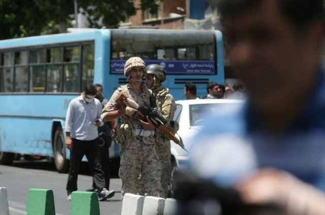 Members of Iranian forces stand guard during an attack on the Iranian parliament in central Tehran, Iran, June 7, 2017. Omid Vahabzadeh/TIMA via REUTERS ATTENTION EDITORS - THIS IMAGE WAS PROVIDED BY A THIRD PARTY. FOR EDITORIAL USE ONLY.