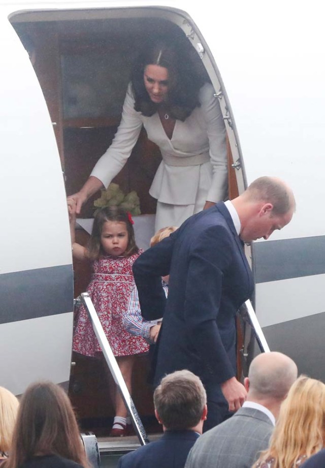 Prince William, the Duke of Cambridge, his wife Catherine, The Duchess of Cambridge, Prince George and Princess Charlotte arrive at a military airport in Warsaw, Poland July 17, 2017. REUTERS/Kacper Pempel