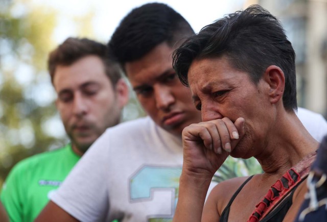 People react in the area where a van crashed into pedestrians at Las Ramblas street in Barcelona, Spain August 18, 2017. REUTERS/Sergio Perez