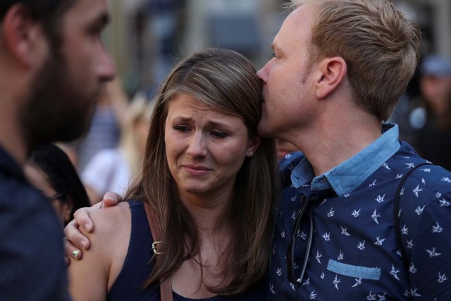 People react in the area where a van crashed into pedestrians at Las Ramblas street in Barcelona, Spain August 18, 2017. REUTERS/Sergio Perez