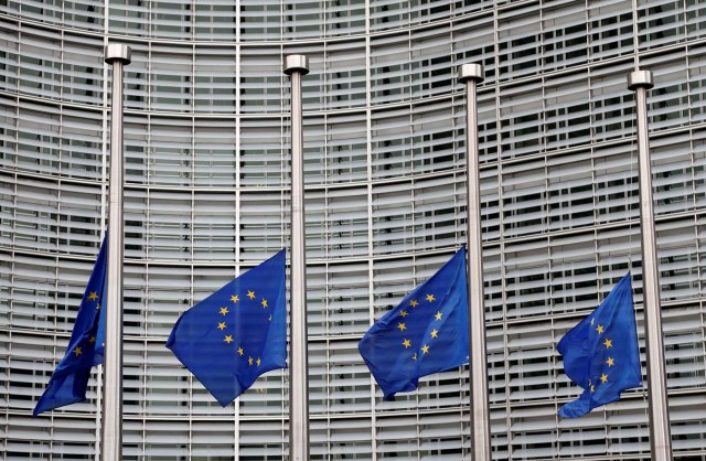 European Union flags are lowered at half-mast in honor of the victims of the Barcelona attack, outside the European Commission headquarters in Brussels, Belgium August 18, 2017. REUTERS/Francois Lenoir