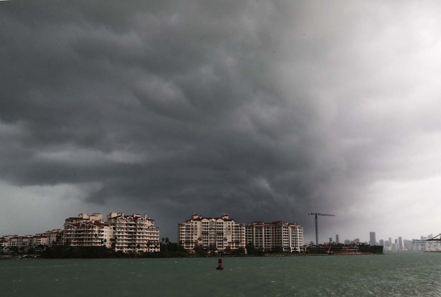 MIAMI BEACH, FL - SEPTEMBER 09: Storm clouds are seen over Fisher Island as Hurricane Irma approaches on September 9, 2017 in Miami Beach, Florida. Florida is in the path of the Hurricane which may come ashore at category 4.   Joe Raedle/Getty Images/AFP