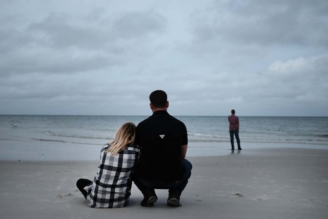 NAPLES, FL - SEPTEMBER 09: People gather around the beach in Naples before the arrival of Hurricane Irma into Southwest Florida on September 9, 2017 in Naples, Florida. The Naples area could begin to feel hurricane-force winds from Irma by 11 a.m. Sunday and experience wind gusts over 100 mph from Sunday through Monday.   Spencer Platt/Getty Images/AFP