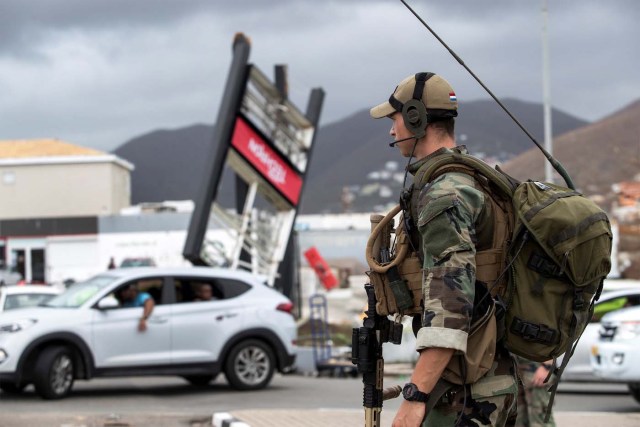 A dutch soldier patrols the streets of Sint Maarten Dutch part of Saint Martin island in the Carribean after the Hurricane Irma September 7, 2017. Picture taken September 7, 2017. Netherlands Ministry of Defence-Gerben van Es/Handout via REUTERS ATTENTION EDITORS - THIS IMAGE HAS BEEN SUPPLIED BY A THIRD PARTY. MANDATORY CREDIT.NO RESALES. NO ARCHIVES