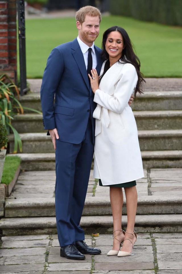 Britain's Prince Harry poses with Meghan Markle in the Sunken Garden of Kensington Palace, London, Britain, November 27, 2017. REUTERS/Eddie Mulholland/Pool