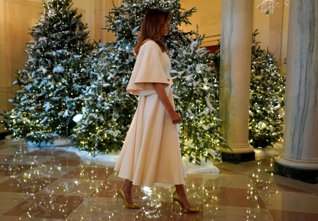 U.S. First Lady Melania Trump greets schoolchildren (not pictured) as she tours the holiday decorations with reporters at the White House in Washington, U.S., November 27, 2017. REUTERS/Jonathan Ernst