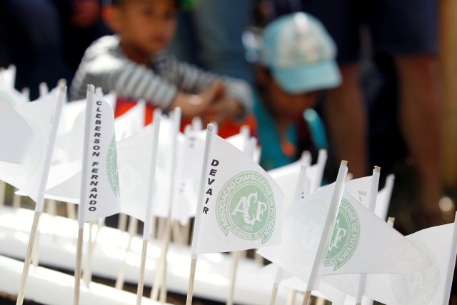 Flags are seen as people pay tribute on the first anniversary of the plane crash where several players of the Chapecoense soccer team died, in La Union, Colombia November 28, 2017. REUTERS/Fredy Builes