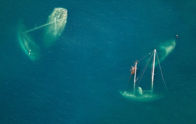 Vessels that sank during Hurricane Irma are seen in a Saint John bay 12 days after the devastating storm raked the island, on St. John, U.S. Virgin Islands September 16, 2017.  REUTERS/Jonathan Drake/File Photo      SEARCH "POY GLOBAL" FOR THIS STORY. SEARCH "REUTERS POY" FOR ALL BEST OF 2017 PACKAGES.    TPX IMAGES OF THE DAY