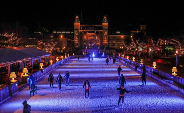 People skate on a temporary ice rink outside the Rijksmuseum in Amsterdam, Netherlands, November 30, 2017. Picture taken November 30, 2017. REUTERS/Yves Herman