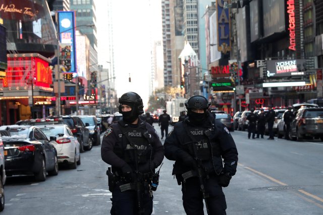 Police officers stand on a closed West 42nd Street near the New York Port Authority Bus Terminal after reports of an explosion in New York City, New York, U.S., December 11, 2017. REUTERS/Mike Segar