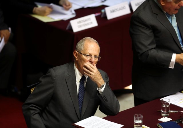 Peru's President Pedro Pablo Kuczynski listens as his lawyer Alberto Borea addresses lawmakers of the opposition-ruled Congress, in Lima, Peru December 21, 2017. REUTERS/Mariana Bazo