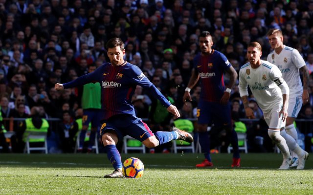 Soccer Football - La Liga Santander - Real Madrid vs FC Barcelona - Santiago Bernabeu, Madrid, Spain - December 23, 2017 Barcelona’s Lionel Messi scores their second goal from the penalty spot REUTERS/Paul Hanna